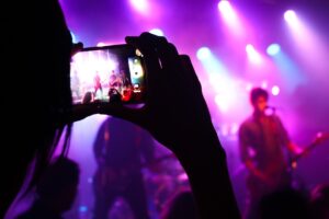 taking photo of concert