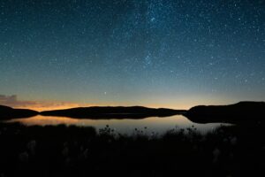 stars in the sky and shadow in water